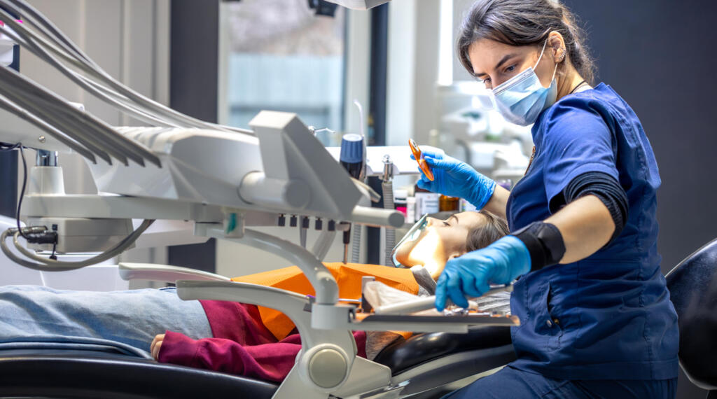 young-female-dentist-in-dental-office-dentist-at-2025-03-15-16-02-16-utc-scaled-e1743951607545
